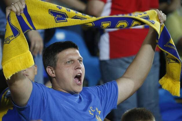 ROSTOV-ON-DON, RUSSIA - AUGUST 24, 2016: Rostov s fan rooting for his team in the 2016 17 UEFA Champions League First playoff round 2nd leg match against Ajax Amsterdam at Olimp-2 Stadium. FC Rostov won the game 4:1. Valery Matytsin TASS  TS02E7FB