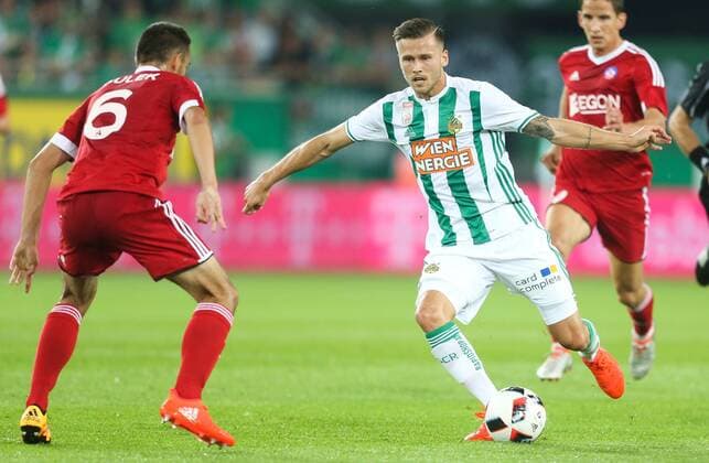 SOCCER - UEFA EL quali, Rapid vs Trencin VIENNA,AUSTRIA,25.AUG.16 - SOCCER - UEFA Europa League, Play-off qualification, SK Rapid Wien vs FK AS Trencin. Image shows Martin Sulek (Trencin) and Arnor Ingvi Traustason (Rapid). Keywords: Wien Energie. GEPAxpictures xPhilippxBrem