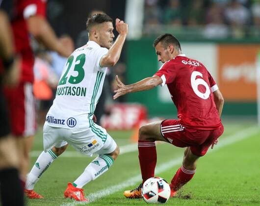 SOCCER - UEFA EL quali, Rapid vs Trencin VIENNA,AUSTRIA,25.AUG.16 - SOCCER - UEFA Europa League, Play-off qualification, SK Rapid Wien vs FK AS Trencin. Image shows Arnor Ingvi Traustason (Rapid) and Martin Sulek (Trencin). Keywords: Wien Energie. GEPAxpictures xPatrickxLeuk