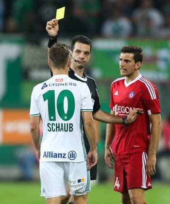 SOCCER - UEFA EL quali, Rapid vs Trencin VIENNA,AUSTRIA,25.AUG.16 - SOCCER - UEFA Europa League, Play-off qualification, SK Rapid Wien vs FK AS Trencin. Image shows Louis Schaub (Rapid), referee Aleksandar Stavrev (MKD) and Jakub Holubek (Trencin). Keywords: Wien Energie. GEPAxpictures xPhilippxBrem