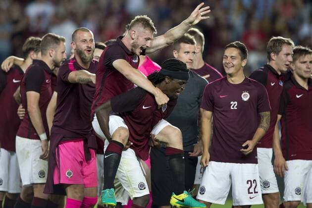 Costa Nhamoinesu bears Jakub Brabec of Sparta as they celebrate victory in the fourth qualifying round return Europa League return match Sparta Praha vs Sonderjyske in Prague, Czech Republic, August 25, 2016. (CTKxPhoto MichalxKamaryt) CTKPhotoP201608251146201  kmt 15