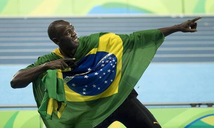 August 19, 2016 - Rio de Janeiro, Brazil - USAIN BOLT of Jamaica celebrates with teammates after winning the gold medal in the Men s 4x100 Finals during Athletics competition at Olympic Stadium during the 2016 Rio Summer Olympics games. RIO 2016 - Athletics: Men s - ZUMAj89_
