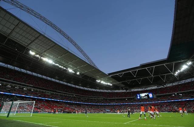 14.09.2016. Wembley Stadium, London, England. UEFA Champions League Football. Tottenham Hotspur versus Monaco. Tottenham players (in orange) warm up before the game. Spurs will play all of their Champions League matches this season due to stadium redevelopment xMarkxKertonx  ActionPlus11789422