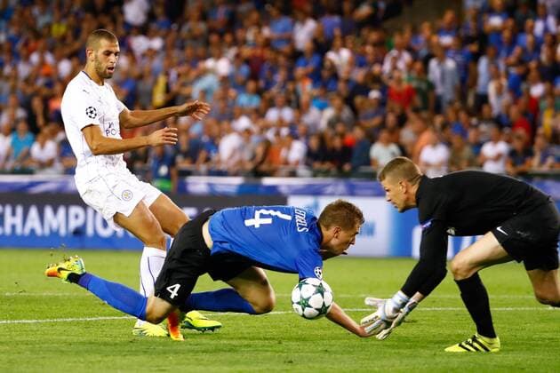 Leicester s Riyad Mahrez, Club s Bjorn Engels and Club s goalkeeper Ludovic Butelle fight for the ball during a game of the first day of the group stage of the UEFA Champions League competition between Belgian first division soccer team Club Brugge KV and English club Leicester City F.C. in the group G in Brugge, Wednesday 14 September 2016. KURTxDESPLENTER  x04931945x