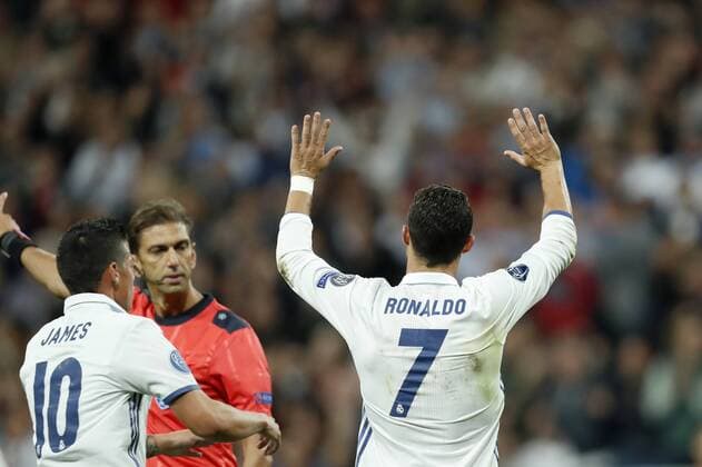 (L-R) James Rodriguez of Real Madrid, referee Paolo Tagliavento, Cristiano Ronaldo of Real Madridduring the UEFA Champions League group F match between Real Madrid and Sporting Club de Portugal on September 14, 2016 at the Santiago Bernabeu stadium in Madrid, Spain. Real Madrid v Sporting Club de Portugal UEFA Champions League 2016 2017 xVIxxIVx 6217727