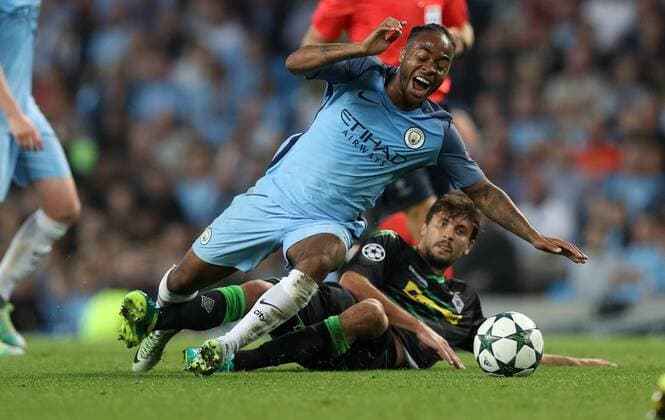 Football - 2016 2017 Champions League - Group C : Manchester City v Borussia Monchengladbach - The Etihad Stadium Raheem Sterling of Manchester City is brought down by Tobias Strobl of Borussia Monchengladbach during the match between Manchester City and Borussia Monchengladbach at The Etihad Stadium COLORSPORT LYNNE CAMERON 