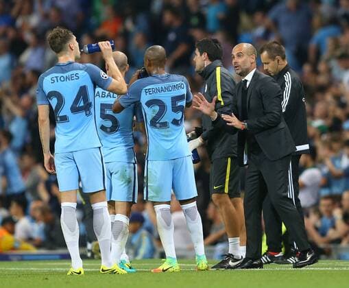John Stones of Manchester City receives instructions from Josep Guardiola manager of Manchester City during the UEFA Champions League Group C match at The Etihad Stadium, Manchester. Picture date: September 14th, 2016. Pic Simon Bellis Sportimage EDITORIAL USE ONLY. No use with unauthorised audio, video, data, fixture lists, club league logos or live services. Online in-match use limited to 120 images, no video emulation. No use in betting, games or single club league player publications.