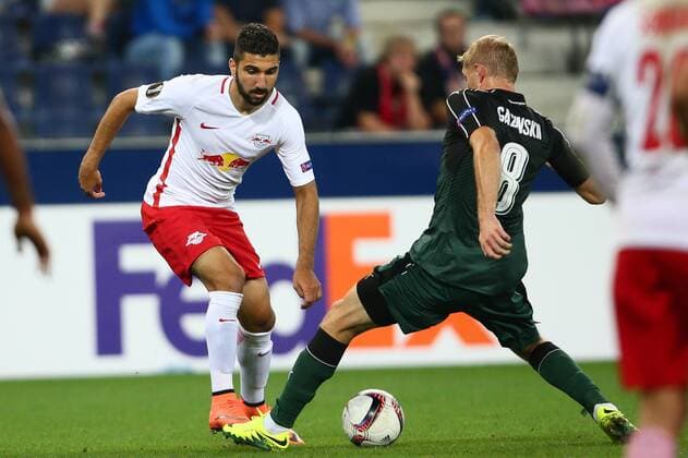 SOCCER - EL, RBS vs Krasnodar SALZBURG,AUSTRIA,15.SEP.16 - SOCCER - UEFA Europa League, group stage, Red Bull Salzburg vs FK Krasnodar. Image shows Munas Dabbur (RBS) and Yuri Gazinski (Krasnodar). GEPAxpictures xFelixxRoittner