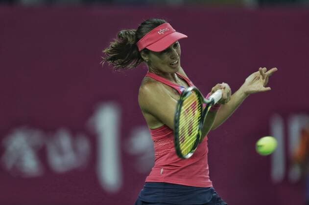 Martina Hingis of Switzerland returns a shot as she and Jelena Jankovic of Serbia compete against Viktorija Golubic of Switzerland and Ipek Soylu of Turkey during their women s doubles quarterfinal match of the WTA Tennis Damen Guangzhou Open 2016 in Guangzhou city, south China s Guangdong province, 22 September 2016. Martina Hingis Jelena Jankovic defeated Viktorija Golubic Ipek Soylu 2:0 (6-0 6-1). Hingis Jankovic advance to semifinal at WTA Guangzhou Open  pbu507851_05