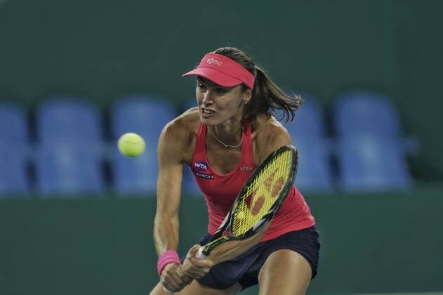 Martina Hingis of Switzerland returns a shot as she and Jelena Jankovic of Serbia compete against Viktorija Golubic of Switzerland and Ipek Soylu of Turkey during their women s doubles quarterfinal match of the WTA Tennis Damen Guangzhou Open 2016 in Guangzhou city, south China s Guangdong province, 22 September 2016. Martina Hingis Jelena Jankovic defeated Viktorija Golubic Ipek Soylu 2:0 (6-0 6-1). Hingis Jankovic advance to semifinal at WTA Guangzhou Open  pbu507851_07