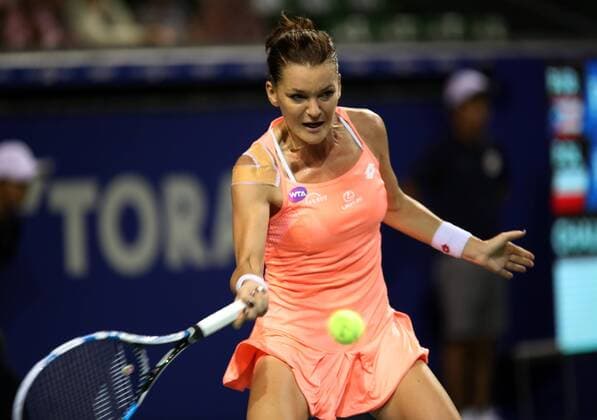 September 23, 2016, Tokyo, Japan - Agnieszka Radwanska of Poland returns the ball against Rio de Janeiro Olympics gold medalist Monica Puig of Puerto Rico during the quarter finals of the Toray Pan Pacific Open tennis championships in Tokyo on Friday, September 23, 2016. Radwanska defeated Puig 6-2, 6-3.  (lwxa004847)