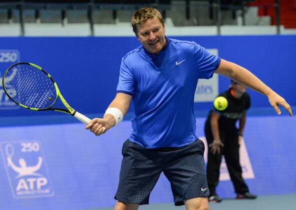 ST PETERSBURG, RUSSIA â€“ SEPTEMBER 25, 2016: Yevgeny Kafelnikov of Russia returns the ball in a mixed doubles match as part of the tennis legends show at the 2016 St. Petersburg Open. Andrei Ivanov TASS  TS032577