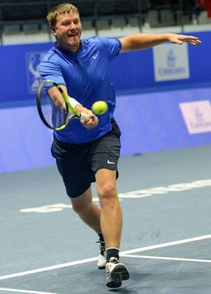 ST PETERSBURG, RUSSIA â€“ SEPTEMBER 25, 2016: Yevgeny Kafelnikov of Russia returns the ball in a mixed doubles match as part of the world tennis legends show at the 2016 St. Petersburg Open. Andrei Ivanov TASS  TS03257A