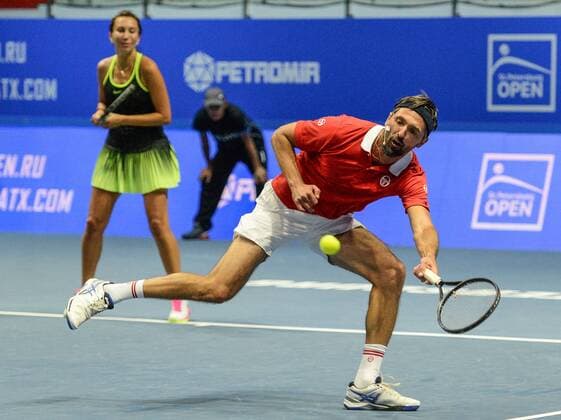 ST PETERSBURG, RUSSIA â€“ SEPTEMBER 25, 2016: Iva Majoli (R) and Goran Ivanisevic of Croatia in action in a mixed doubles match against Anastasia Myskina and Yevgeny Kafelnikov of Russia as part of the world tennis legends show at the 2016 St. Petersburg Open. Andrei Ivanov TASS  TS03258A