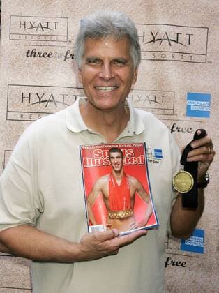 Aug 20, 2008 - New York, NY, USA - 7 time Olympic gold swimming legend MARK SPITZ holds a Hyatt Gold medal and 8 time Olympic gold swimming champion Mark Phelps Sports Illustrated magazine cover. Spitz coached couples competing in Hyatt Resorts Three for Free Vacation Training Camp contest held at Grand Central Station Mark Spitz at Grand Central Station for Hyatt - ZUMAk03_