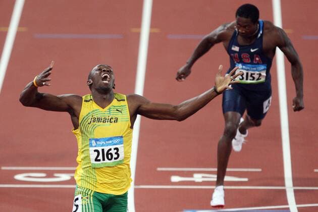 8 20 2008 Beijing, China.At the National Indoor Stadium, Track and Field. Usain Bolt of Jamaica sets a new world record in the mens 200m with a time of 19.30. He crossed a half second ahead of the next best finisher. Seen here reacting as Shawn Crawford USA takes the bronze. Photo: Sean M. Haffey San Diego News - August 20, 2008 - ZUMAs44_