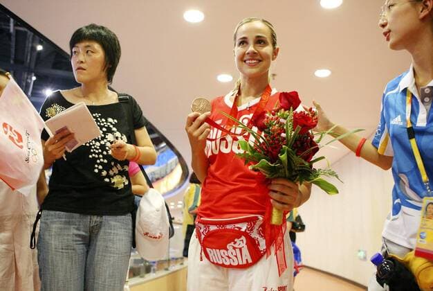 FOR SPORTS - Russia s Becky Hammon poses for fans photos with her bronze medal after the Women s Basketball medal ceremony at the 2008 Beijing Olympics Saturday Aug 23, 2008 in Beijing, China. The Russian team won the bronze, the Australia team won the silver and the USA team won the gold Texas News - August 23, 2008 - ZUMAa27_