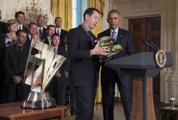 President Barack Obama receives a helmet from Kyle Busch as he honors him and his team for their 2015 NASCAR Motorsport USA Sprint Cup Series championship, in Washington, D.C. on September 28, 2016.  WAP20160928315 KEVINxDIETSCH
