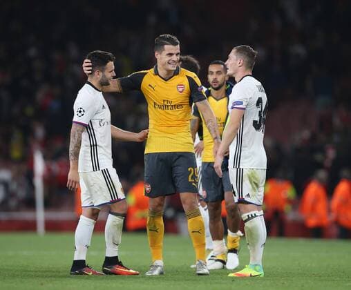 Arsenal s Granit Xhaka embraces brother Taulant Xhaka of Basel at the final whistle during the Champions League group A match at the Emirates Stadium, London. Picture date September 28th, 2016 Pic David Klein Sportimage EDITORIAL USE ONLY. No use with unauthorised audio, video, data, fixture lists, club league logos or live services. Online in-match use limited to 120 images, no video emulation. No use in betting, games or single club league player publications.