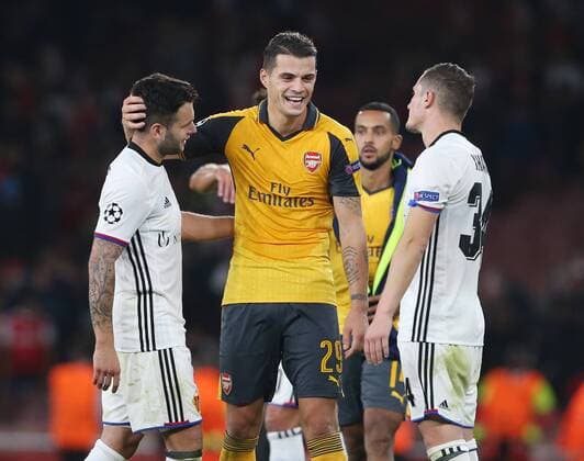 Arsenal s Granit Xhaka embraces brother Taulant Xhaka of Basel at the final whistle during the Champions League group A match at the Emirates Stadium, London. Picture date September 28th, 2016 Pic David Klein Sportimage EDITORIAL USE ONLY. No use with unauthorised audio, video, data, fixture lists, club league logos or live services. Online in-match use limited to 120 images, no video emulation. No use in betting, games or single club league player publications.