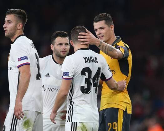 Arsenal s Granit Xhaka embraces brother Taulant Xhaka of Basel at the final whistle during the Champions League group A match at the Emirates Stadium, London. Picture date September 28th, 2016 Pic David Klein Sportimage EDITORIAL USE ONLY. No use with unauthorised audio, video, data, fixture lists, club league logos or live services. Online in-match use limited to 120 images, no video emulation. No use in betting, games or single club league player publications.