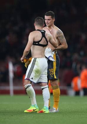 Arsenal s Granit Xhaka embraces brother Taulant Xhaka of Basel at the final whistle during the Champions League group A match at the Emirates Stadium, London. Picture date September 28th, 2016 Pic David Klein Sportimage EDITORIAL USE ONLY. No use with unauthorised audio, video, data, fixture lists, club league logos or live services. Online in-match use limited to 120 images, no video emulation. No use in betting, games or single club league player publications.
