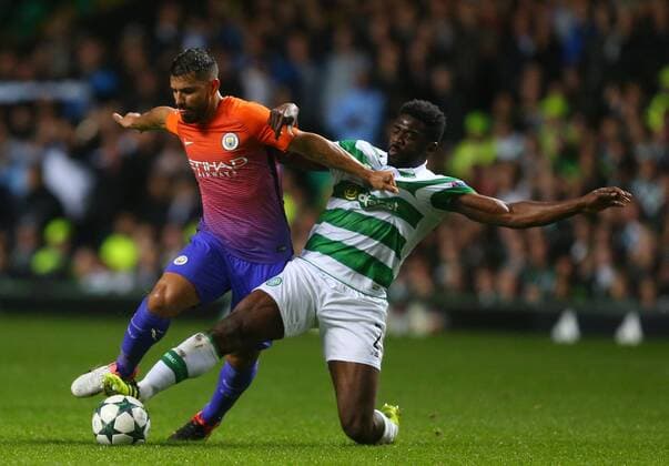 Sergio Aguero of Manchester City tackled by Kolo Toure of Celtic during the Champions League Group C match at the Celtic Park Stadium, Glasgow. Picture date: September 28th, 2016. Pic Simon Bellis Sportimage EDITORIAL USE ONLY. No use with unauthorised audio, video, data, fixture lists, club league logos or live services. Online in-match use limited to 120 images, no video emulation. No use in betting, games or single club league player publications.