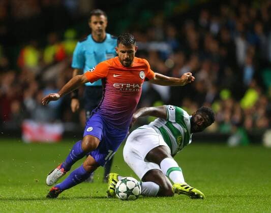 Sergio Aguero of Manchester City skips past Kolo Toure of Celtic during the Champions League Group C match at the Celtic Park Stadium, Glasgow. Picture date: September 28th, 2016. Pic Simon Bellis Sportimage EDITORIAL USE ONLY. No use with unauthorised audio, video, data, fixture lists, club league logos or live services. Online in-match use limited to 120 images, no video emulation. No use in betting, games or single club league player publications.