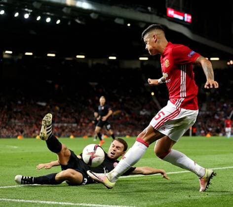 Marcos Rojo of Manchester United ManU crosses the ball during the UEFA Europa League match at Old Trafford Stadium, Manchester. Picture date: September 29th, 2016. Pic Matt McNulty Sportimage EDITORIAL USE ONLY. No use with unauthorised audio, video, data, fixture lists, club league logos or live services. Online in-match use limited to 120 images, no video emulation. No use in betting, games or single club league player publications.
