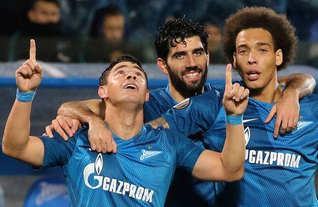 ST PETERSBURG, RUSSIA â€“ SEPTEMBER 29, 2016: FC Zenit St Petersburg s Victor Giuliano, Luis Neto, and Axel Witsel (L-R) celebrate scoring in their 2016 17 UEFA Europe League Group D Round 2 football match against AZ Alkmaar at Petrovsky Stadium. FC Zenit won the game 5-0. Alexander Demianchuk TASS  TS032CEC
