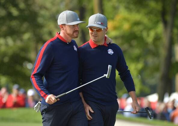 USA team member Jimmy Walker (L) and Zach Johnson embrace after winning the 12th hole during day 1 of the 2016 Ryder Cup at Hazeltine National Golf Club in Chaska, Minnesota on September 30, 2016.  MIN20160930314 KEVINxDIETSCH