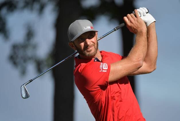 USA team member Dustin Johnson hits off of the 13th tee during day 1 of the 2016 Ryder Cup at Hazeltine National Golf Club in Chaska, Minnesota on September 30, 2016.  MIN20160930310 KEVINxDIETSCH