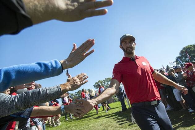 USA team member Dustin Johnson greets fans after finishing his match during day 1 of the 2016 Ryder Cup at Hazeltine National Golf Club in Chaska, Minnesota on September 30, 2016.  MIN20160930304 KEVINxDIETSCH