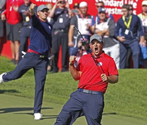 Sep 30, 2016: Chaska, MN, USA; Patrick Reed reacts to making a putt to win the match as Jordan Spieth celebrates in the background on the 16th hole as they defeat Henrik Stenson and Justin Rose during the Day 1 morning matches for the 2016 Ryder Cup at Hazeltine National Golf Club. (Photo by Brian Spurlock Icon Sportswire) GOLF: SEP 30 PGA Golf Herren - Ryder Cup - Day One Icon1609308271 EDITORIAL USE ONLY