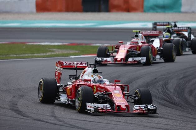 Formel 1, GP Malaysia Malaysian Grand Prix, Sepang 29 September - 2 October 2016 02.10.2016 - Race, Sebastian Vettel (GER) Scuderia Ferrari SF16-H leads Kimi Raikkonen (FIN) Scuderia Ferrari SF16-H 