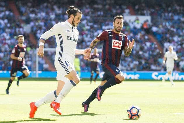 Real Madrid s player Gareth Bale and Eibar FC s player Antonio Luna during a match of La Liga Santander at Santiago Bernabeu Stadium in Madrid. October 02, Spain. 2016.  (20161002053)