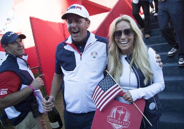 USA team member Phil Mickelson and his wife Amy celebrate after the USA won the 2016 Ryder Cup at Hazeltine National Golf Club in Chaska, Minnesota on October 2, 2016. USA defeated Europe 17-11 to win the Ryder Cup for the first time since 2008.  MIN20161002330 KEVINxDIETSCH