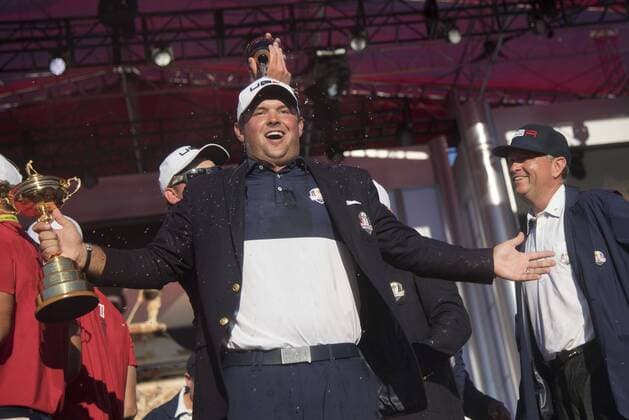 USA team member Patrick Reed celebrates with the Ryder Cup after the United States defeated Europe 17-11 to win the 2016 Ryder Cup at Hazeltine National Golf Club in Chaska, Minnesota on October 2, 2016. USA defeated Europe for the first time since 2008.  MIN20161002334 KEVINxDIETSCH