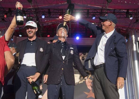 Golf, Ryder Cup 2016 in Chaska USA team vice captain Tom Lehman pours champions on Rickie Fowler after the United States defeated Europe 17-11 to win the 2016 Ryder Cup at Hazeltine National Golf Club in Chaska, Minnesota on October 2, 2016. USA defeated Europe for the first time since 2008.  MIN20161002341 KEVINxDIETSCH