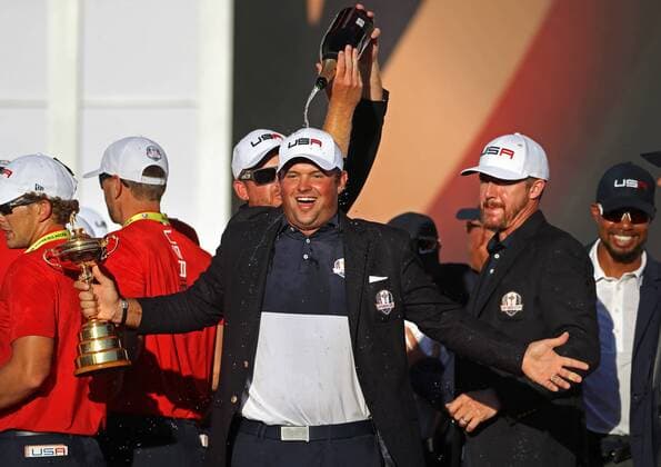 October 2, 2016 - Chaska, MN, USA - Patrick Reed with the Ryder Cup and a champaigne shower by Ryan Moore on Sunday, Oct. 2, 2016 at the conclusion of 2016 Ryder Cup at the Hazeltine National Golf Club in Chaska, Minn. Ryder Cup staying as United States closes out Europe; first victory since 2008 - ZUMAm67_