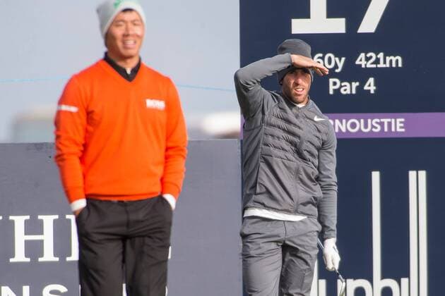 06.10.2016. Carnoustie Golf Course, Fife, Scotland. Alfred Dunhill Links Championship Golf 1st Round. Romain Wattel watches his shot as he tees off the 17th at Carnoustie on the first round of the Dunhill Links Championship Golf while Ashun Wu watches on. xDuncanxMcGlynnx  ActionPlus11797184