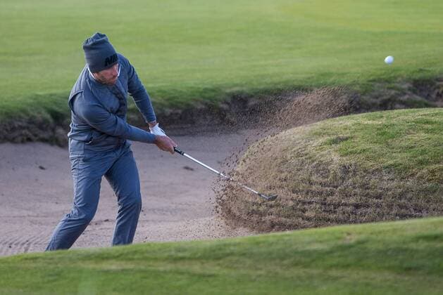 06.10.2016. Carnoustie Golf Course, Fife, Scotland. Alfred Dunhill Links Championship Golf 1st Round. Romain Wattel clearing his ball from the bunker on the 18th Hole at Carnoustie Golf Course in Fife, Scotland as part of the Dunhill Links Championship Golf xDuncanxMcGlynnx  ActionPlus11797192