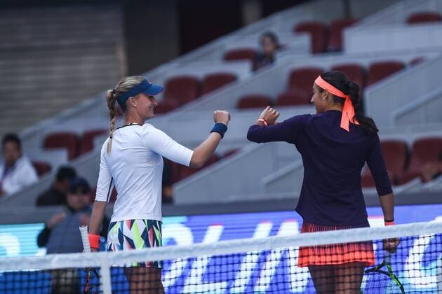 BEIJING, CHINA - OCTOBER 08: Caroline Garcia and Kristina Mladenovic of France celebrate after winning the Women s doubles semifinals against Hao-Ching Chan and Yung-Jan Chan of Chinese Taipei on day eight of the 2016 China Open at the China National Tennis Centre on October 8, 2016 in Beijing, China.  CFP493487114 