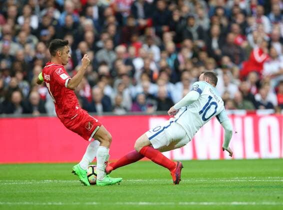 England s Wayne Rooney fouls Malta s Andre Schembri but is not booked during the World Cup Qualifying Group F match at Wembley Stadium, London. Picture date October 8th, 2016 Pic David Klein Sportimage EDITORIAL USE ONLY. No use with unauthorised audio, video, data, fixture lists, club league logos or live services. Online in-match use limited to 120 images, no video emulation. No use in betting, games or single club league player publications.