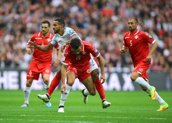 08.10.2016. Wembley Stadium, London, England. FIFA World Cup WM Weltmeisterschaft Fussball Qualifying Football. England versus Malta. England Midfielder Theo Walcott is tackled by Malta Defender Zach Muscat xMarkxKertonx  ActionPlus11798063