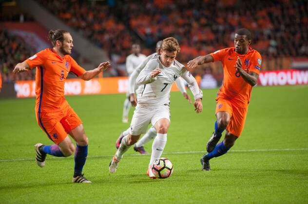 World Cup Qualifier The Netherlands - France Amsterdam The Netherlands 10th October 2016 World Cup Qualifier The Netherlands - France Antoine Griezmann attacks for the French in the first half. Daley Blind and Georgino Wijnaldum defends for the Dutch. Photo Richard Wareham 