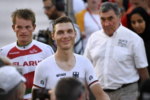 Belarusian Vasil Kiryienka of Team Sky, German Tony Martin of team Etixx - Quick-Step and Former Belgian cyclist Eddy Merckx pictured after the men elite individual time trial at the 2016 UCI World Road World Cycling Championships in Doha, Qatar, Wednesday 12 October 2016. YORICKxJANSENS  x04954699x