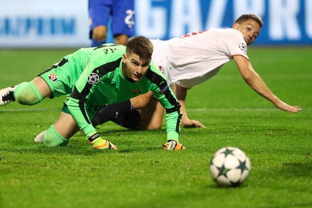 SOCCER - CL, Zagreb vs Sevilla ZAGREB,CROATIA,18.OCT.16 - SOCCER - UEFA Champions League, group stage, GNK Dinamo Zagreb vs Sevilla FC. Image shows Samir Nasri (Sevilla) and Dominik Livakovic (Zagreb). GEPAxpictures xMaticxKlansek