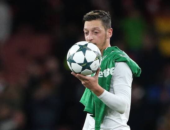 Arsenal s Mesut Ozil celebrates with the match ball during the Champions League group A match at the Emirates Stadium, London. Picture date October 19th, 2016 Pic David Klein Sportimage EDITORIAL USE ONLY. No use with unauthorised audio, video, data, fixture lists, club league logos or live services. Online in-match use limited to 120 images, no video emulation. No use in betting, games or single club league player publications.