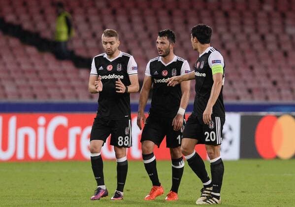 UEFA Champions League Group B match between Napoli and Besiktas at San Paolo Stadium in Napoli, Italy , 19 October 2016. Final Score : Napoli 2 - Besiktas 3 Pictured Caner Erkin (L) , Tolgay Arslan , Necip Uysal (R) of Besiktas . 